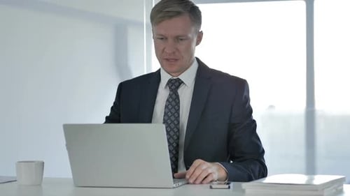 Businessman Leaving Office After Work