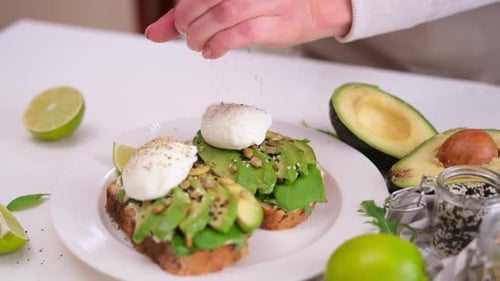 Preparing Healthy Avocado Toast with Poached Egg