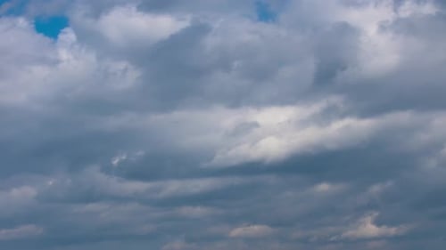 Fluffy Cumulus Clouds Moving Fast in Timelapse