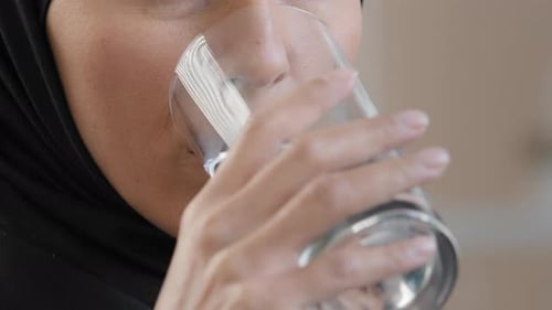 Happy Muslim Young Girl in Hijab Drinking Pure Mineral Water Hydrating Thirst Enjoy Refreshing Taste