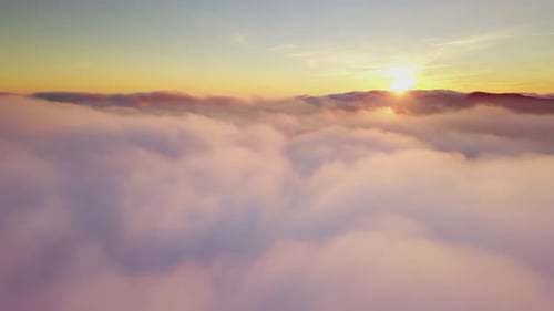 Sunrise Over Clouds: Golden Aerial View