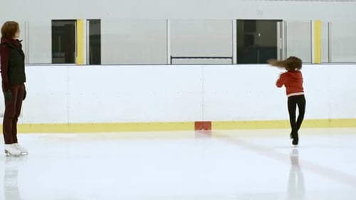 Child Figure Skating on Ice Rink