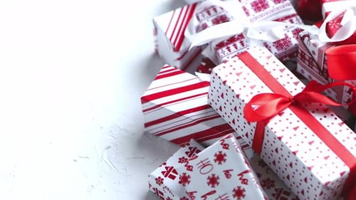 Pile of Red and White Christmas Presents
