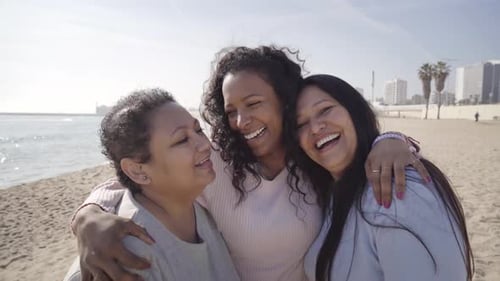 Happy 3 Three Generations Latin Women Family Smiling and Hugging Laughing Looking at Camera at Beach