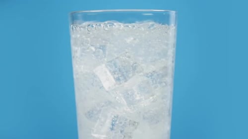 Ice Cubes in Glass with Bubbly Water