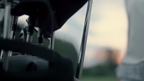 Woman Taking Golf Club at Sport Equipment Bag