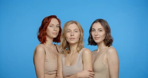 Three Beautiful Women Posing Together in Studio