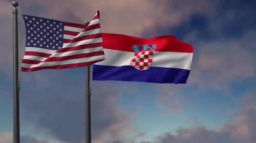 United States And Croatia Flags Waving On Flagpoles Against Cloudy Sky