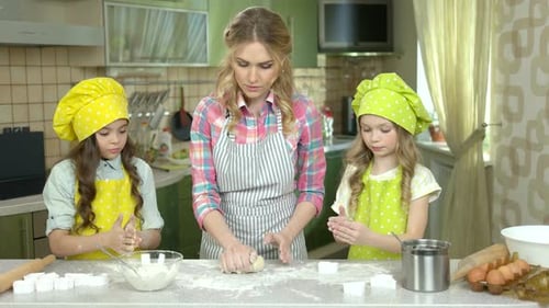 Family Baking Pastries Together in Kitchen