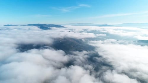 Fly Above Clouds Over Mountains