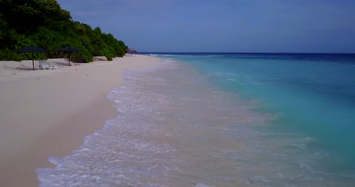 Tropical drone island view of a sunshine white sandy paradise beach and turquoise sea background in