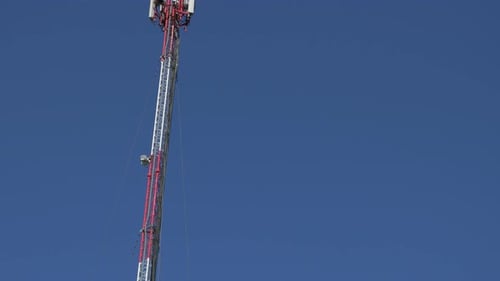 Cellular Tower Against a Clear Blue Sky