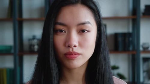Close up portrait of attractive young woman indoors