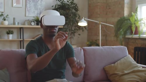 Man Using VR Headset in Apartment