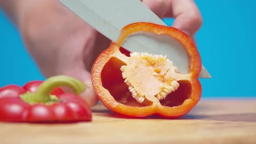 Cutting a Ripe Red Bell Pepper in Half