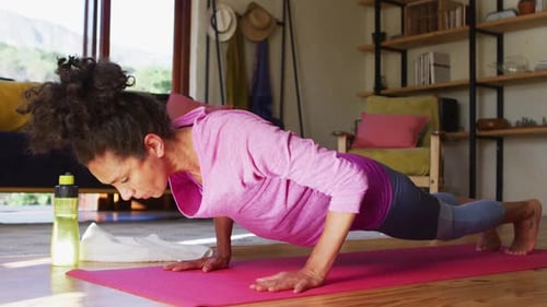Fit Woman Doing Pushups and Yoga at Home