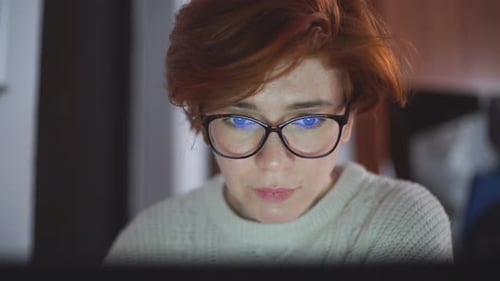 Overtime Concept. Woman Is Working with Computer at Office During Night