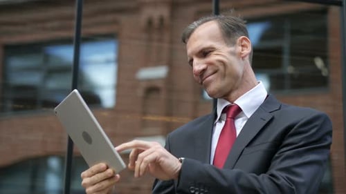 Businessman Using Tablet