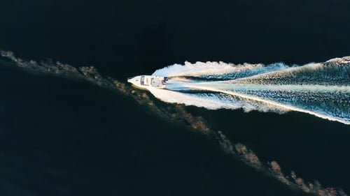 Boat Going Through the Polluted Sea with a Wave Top View