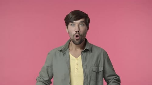 Man in Shock with Hands to Face