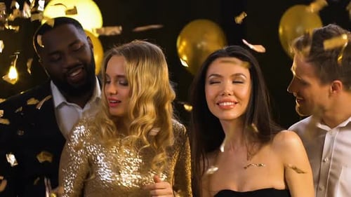 Friends Dancing Under Confetti at Night Party