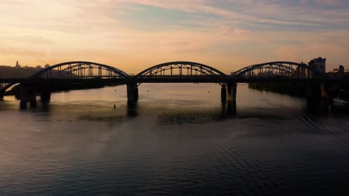 Side View of a City Bridge with Evening Sunset Sky