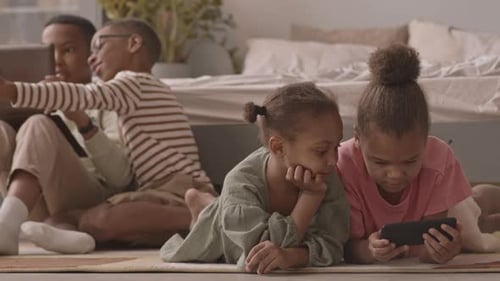 Children Relaxing with Tablets and Smart Phones