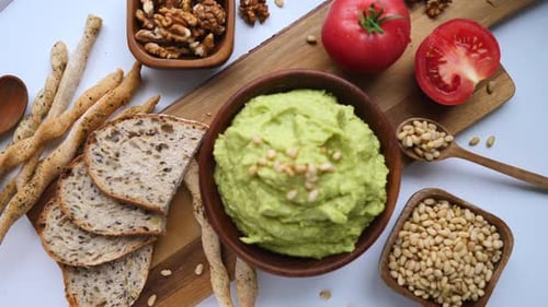 Guacamole Avocado Sauce And Fresh Bread On Table