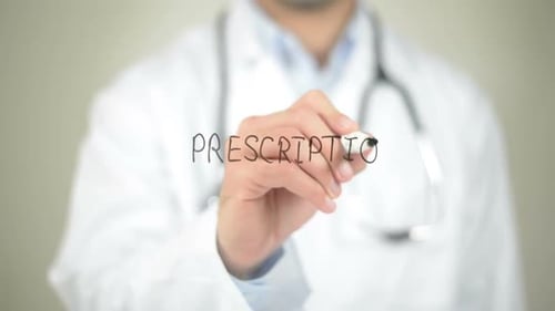 Doctor Writing Prescription in Medical Setting