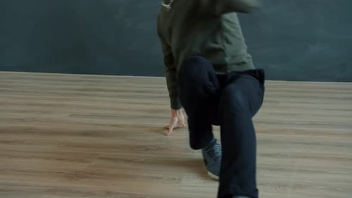 Talented Male Dancer Performing Hip-hop Dance Indoors in Modern Studio