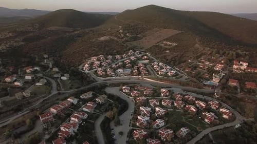 Aerial Scene of Neighbourhood and Green Hills in Trikorfo Beach, Greece