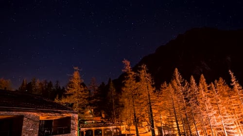 Night Sky Time-Lapse over Mountain Cabin