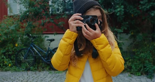 Woman Taking Pictures With Camera Outdoors
