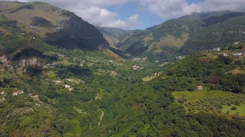 Aerial View of Mountain Gorge Hills Covered with Green Forest. Italian Landscape Sunny Weather