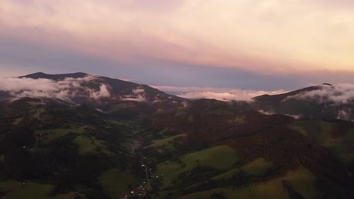 Foothill Village in a Hilly Landscape After the Rain at Sunset