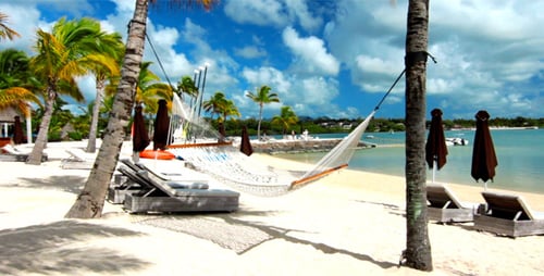 Tropical Beach with Hammock and Lounge Chairs