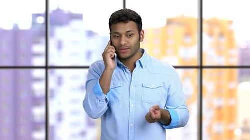 Young Adult Male Talking on a Mobile Phone