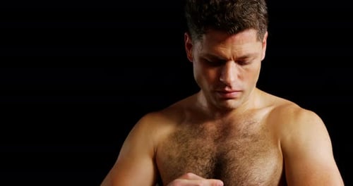 Muscular man with fighting gloves close up
