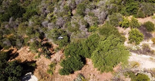 Drone flying over mountains, DJI Inspire 2 filming at sun light. Unmanned aircraft control