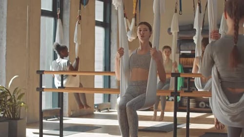 Women Exercise with Aerial Yoga Hammocks