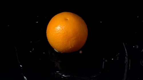 Falling of Orange in Water