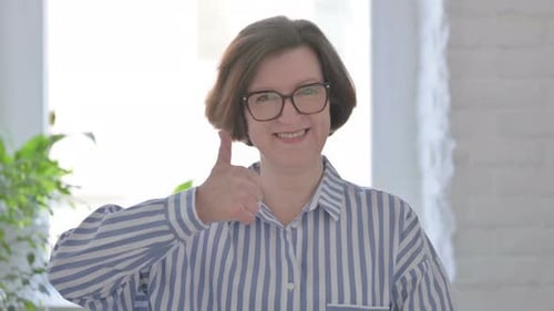 Portrait of Senior Woman Showing Thumbs Up Sign