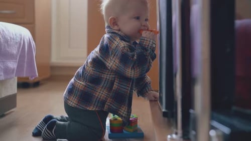 Infant playing with toys in bright home