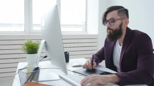 Concept of Professional Photography and Graphic Design. Young Stylish Man Graphic Designer