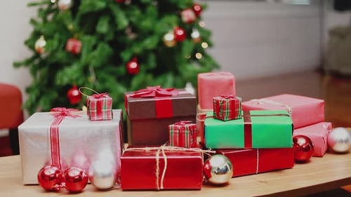 Christmas Presents and Ornaments by Decorated Tree