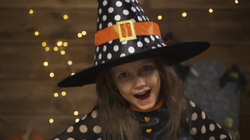 Cute Child in Witch Costume Smiling