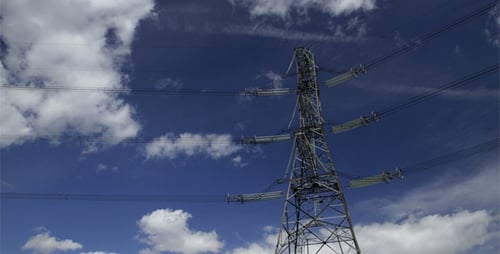 Electric Tower Against Cloudy Blue Sky