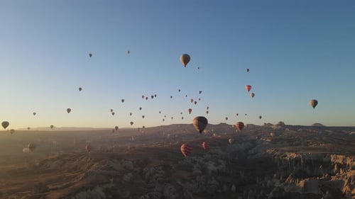 Scenic Hot Air Balloons Fly Over Cappadocia at Sunrise