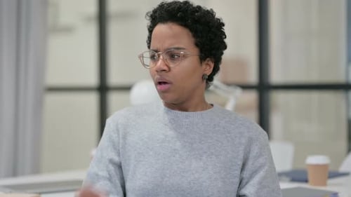Young Woman Coughs at the Office