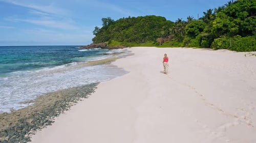 Young Woman Walks on the Sand Paradise Anse Bazarca Beach
